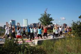 Premium Photo  Yoga in the park overlooking the river, with